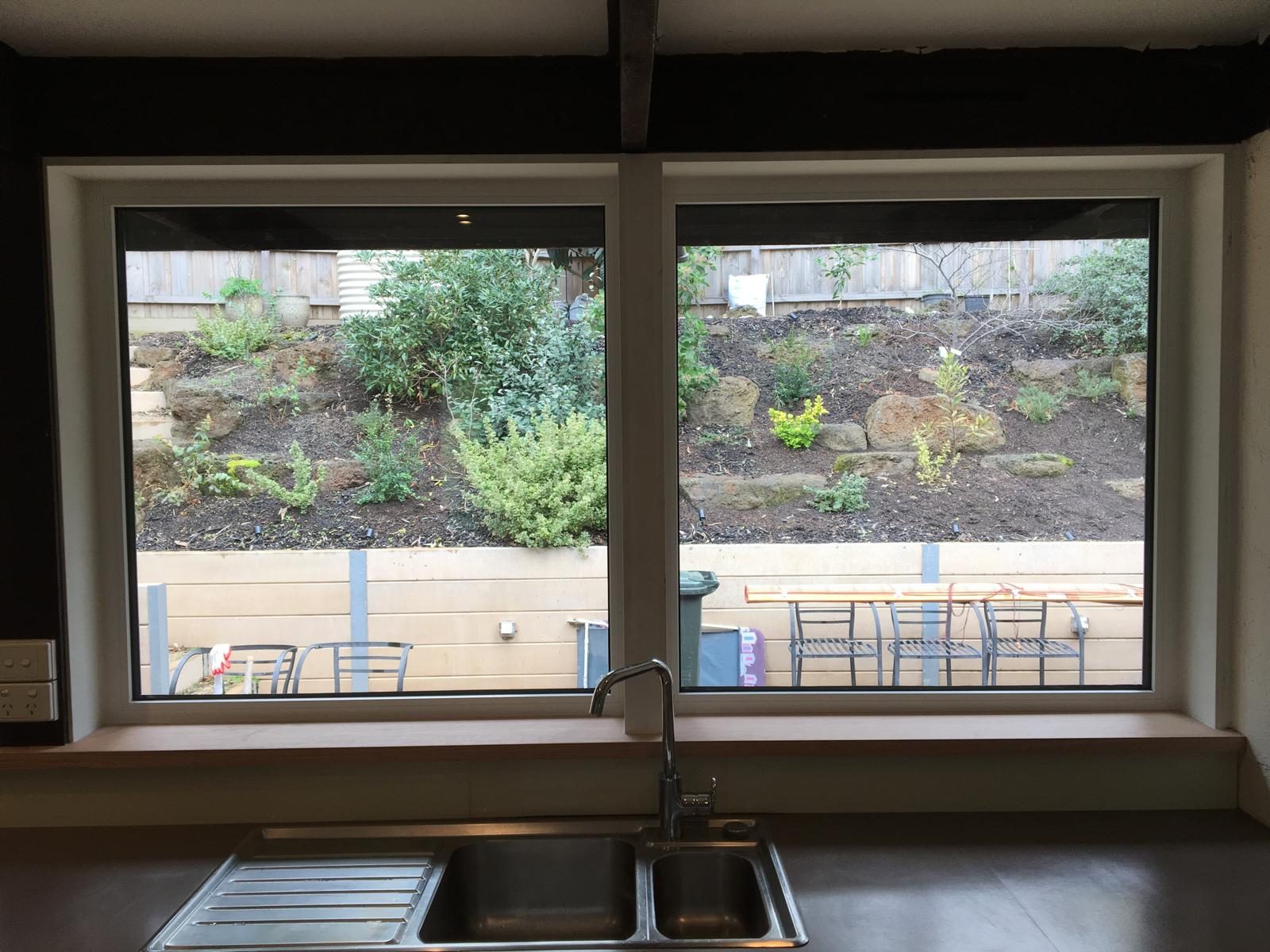 Wide double glazed window above a kitchen sink