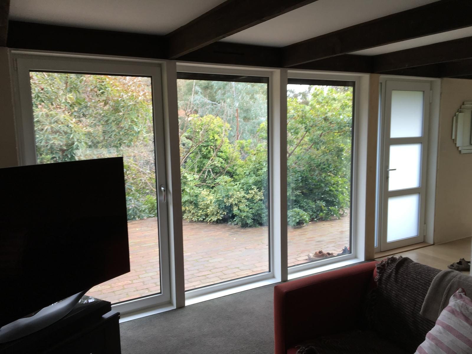 Wide sliding door run across a living room wall