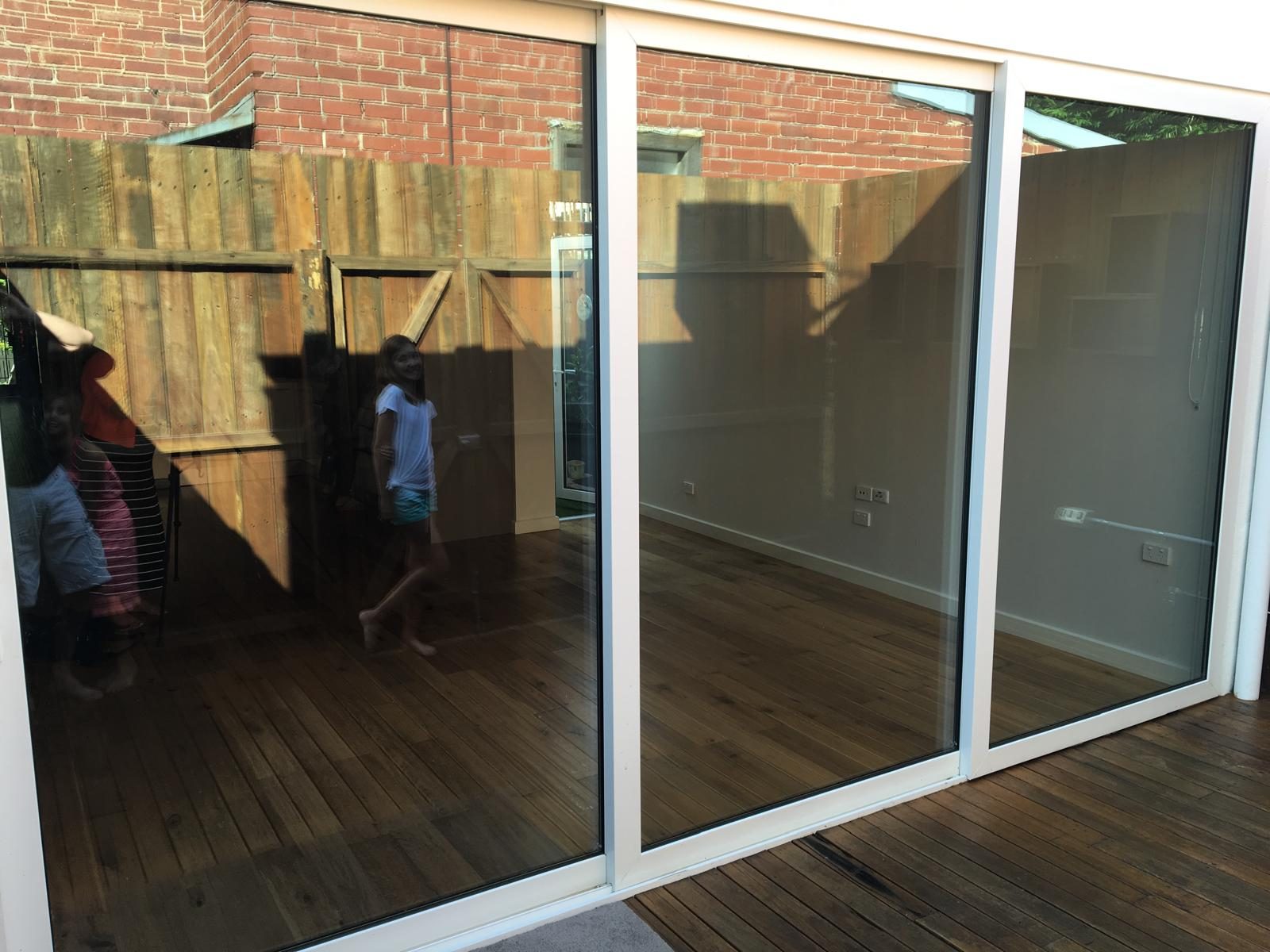 Large sliding door onto a timber deck