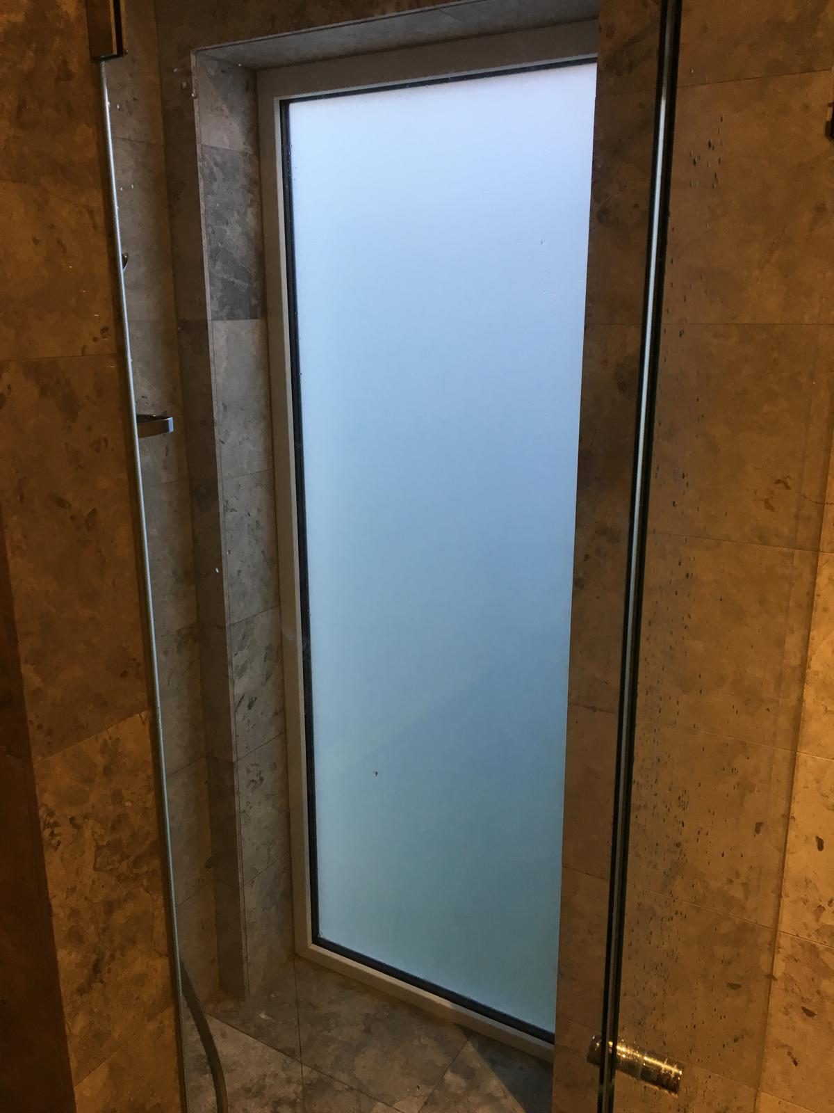 Obscure glazed panel during installation
