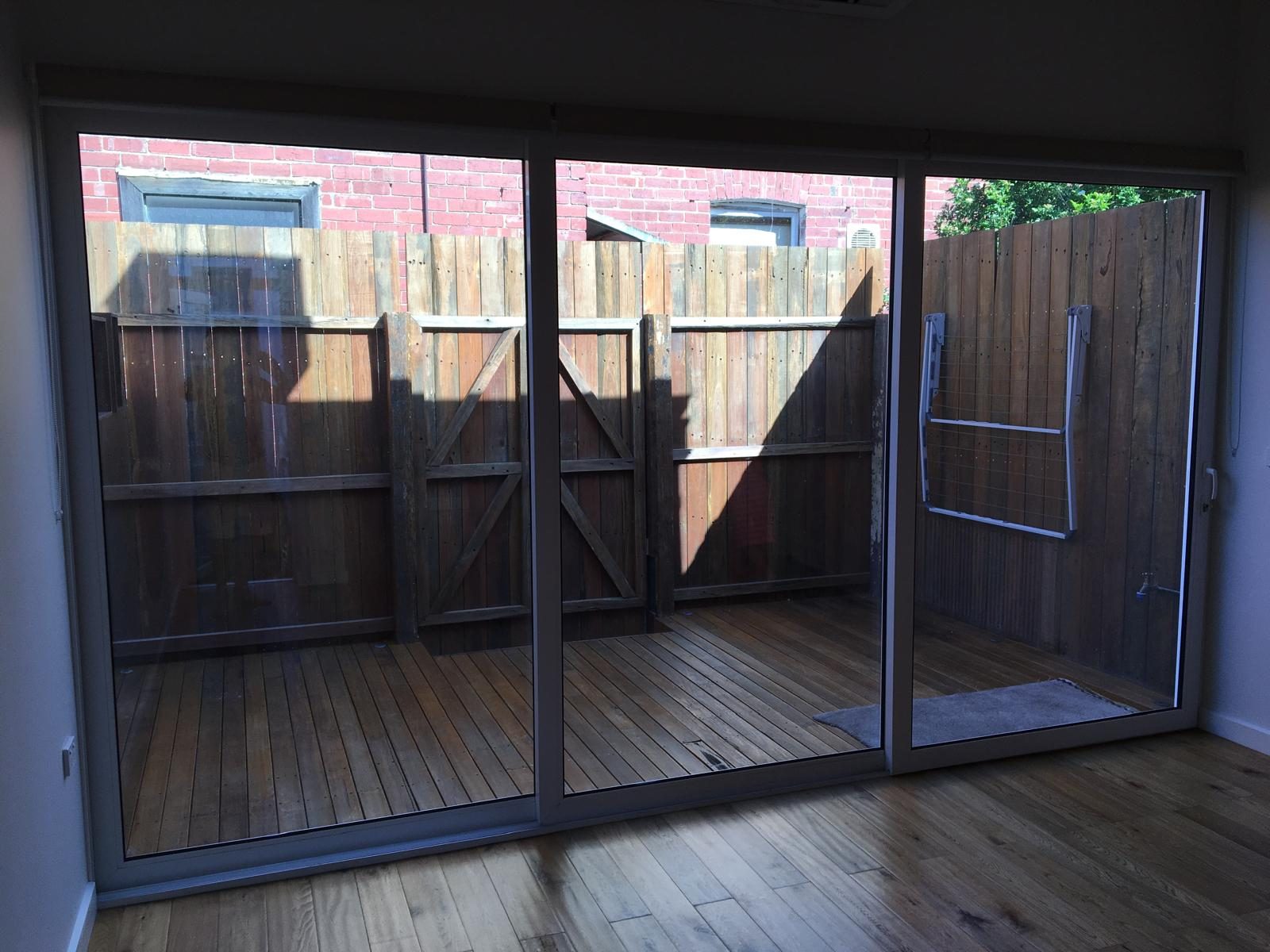 Charcoal sliding door set onto a deck
