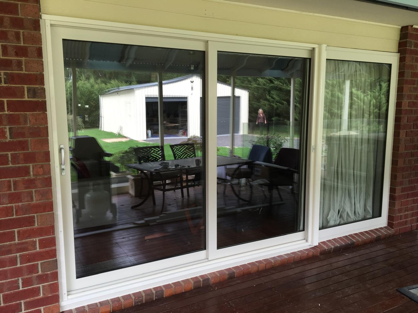 Sliding door onto a timber deck and patio