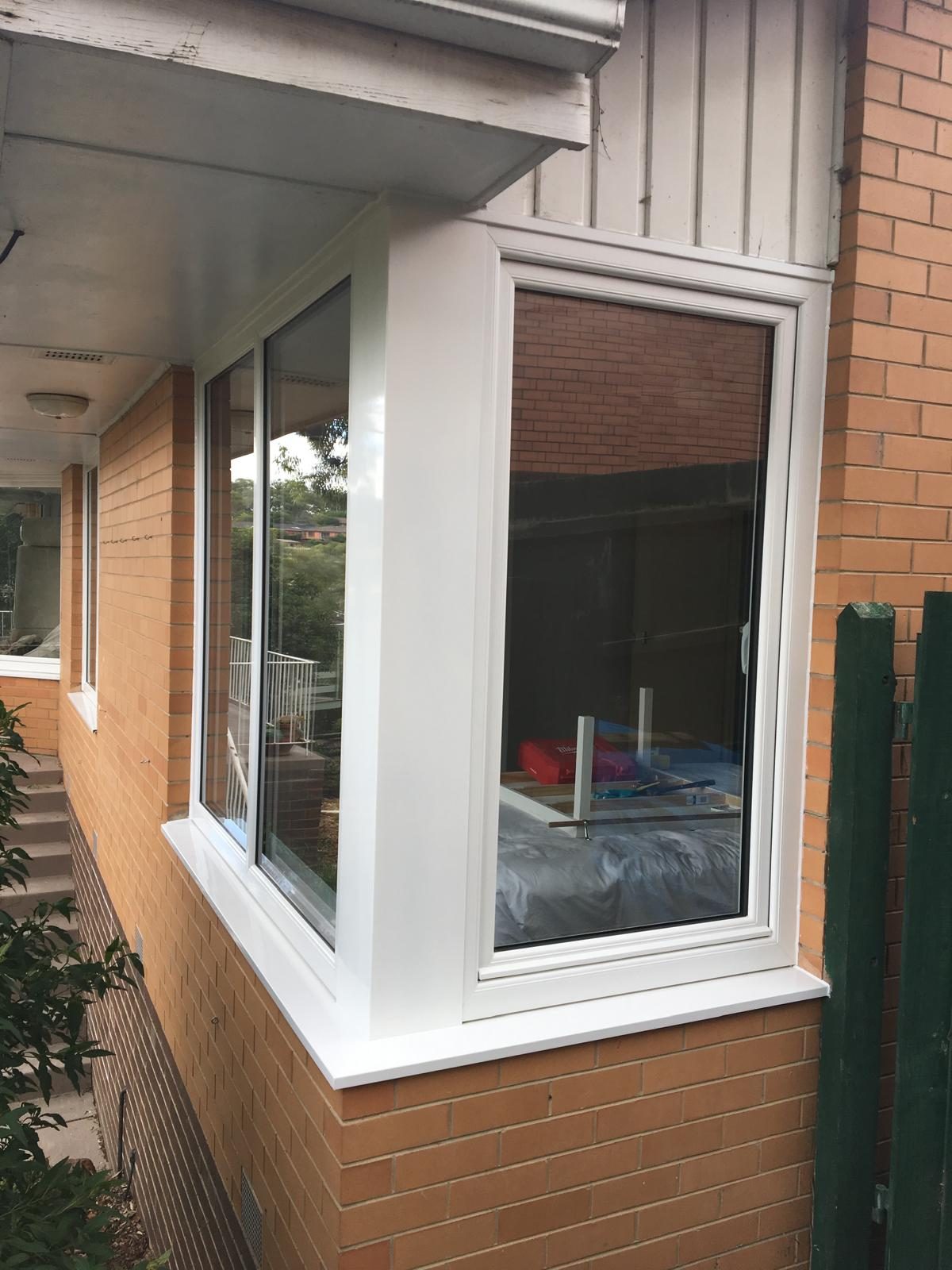 White uPVC corner window on brickwork