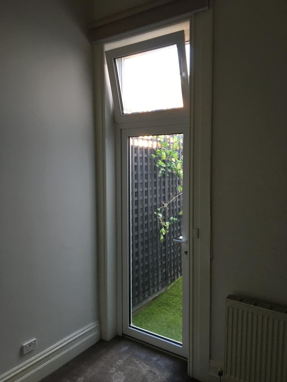 Glazed entry door with highlight window