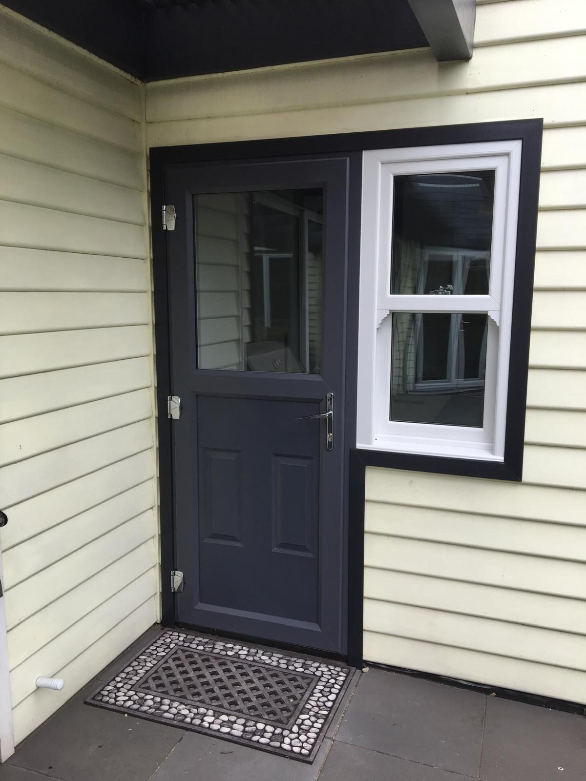 uPVC entry door on a weatherboard home