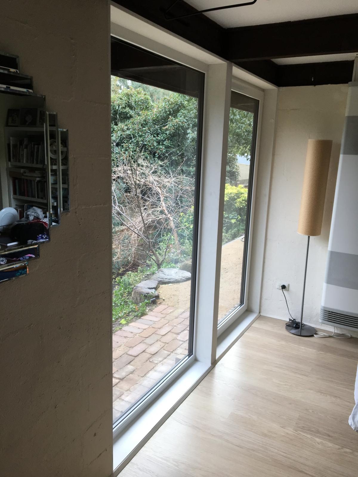 Corner glazing joining two living room walls