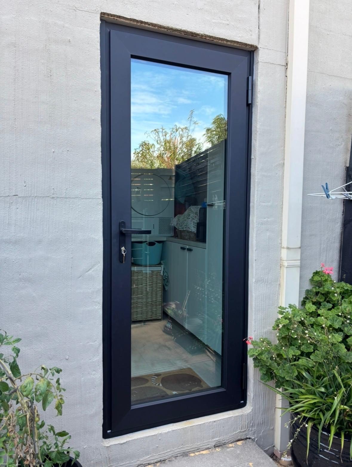 Charcoal uPVC hinged door with full height glazing