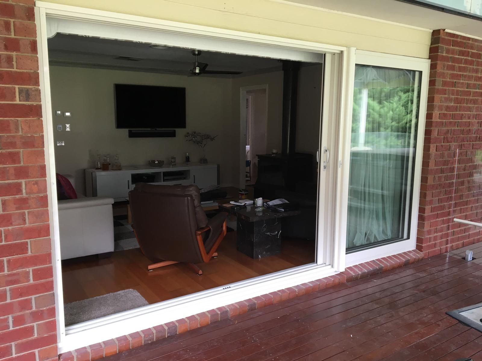 Large sliding door set in a red brick façade