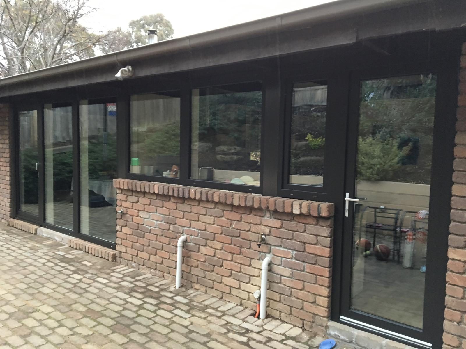 Long run of double glazed windows across a rear wall