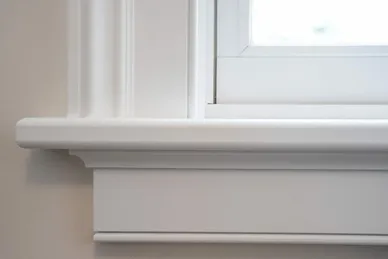 Window board & apron internal finish detail on a double glazed uPVC window