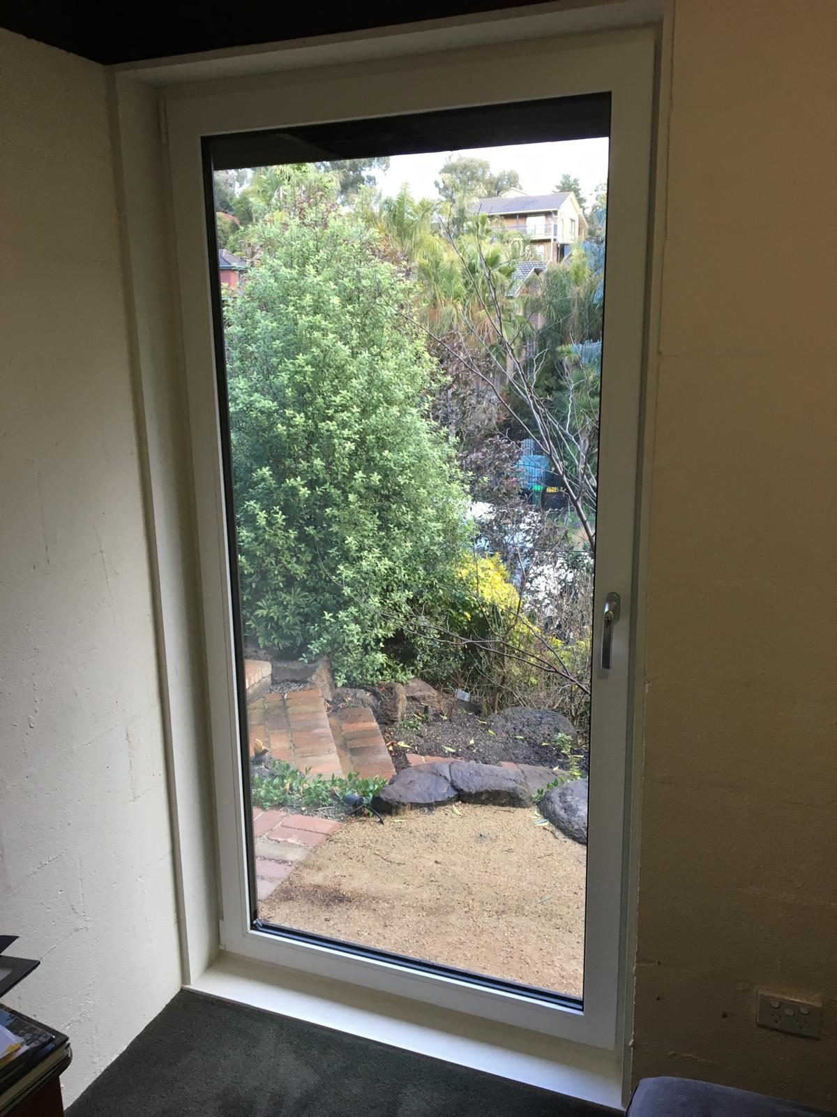 White uPVC tilt and turn window with garden outlook