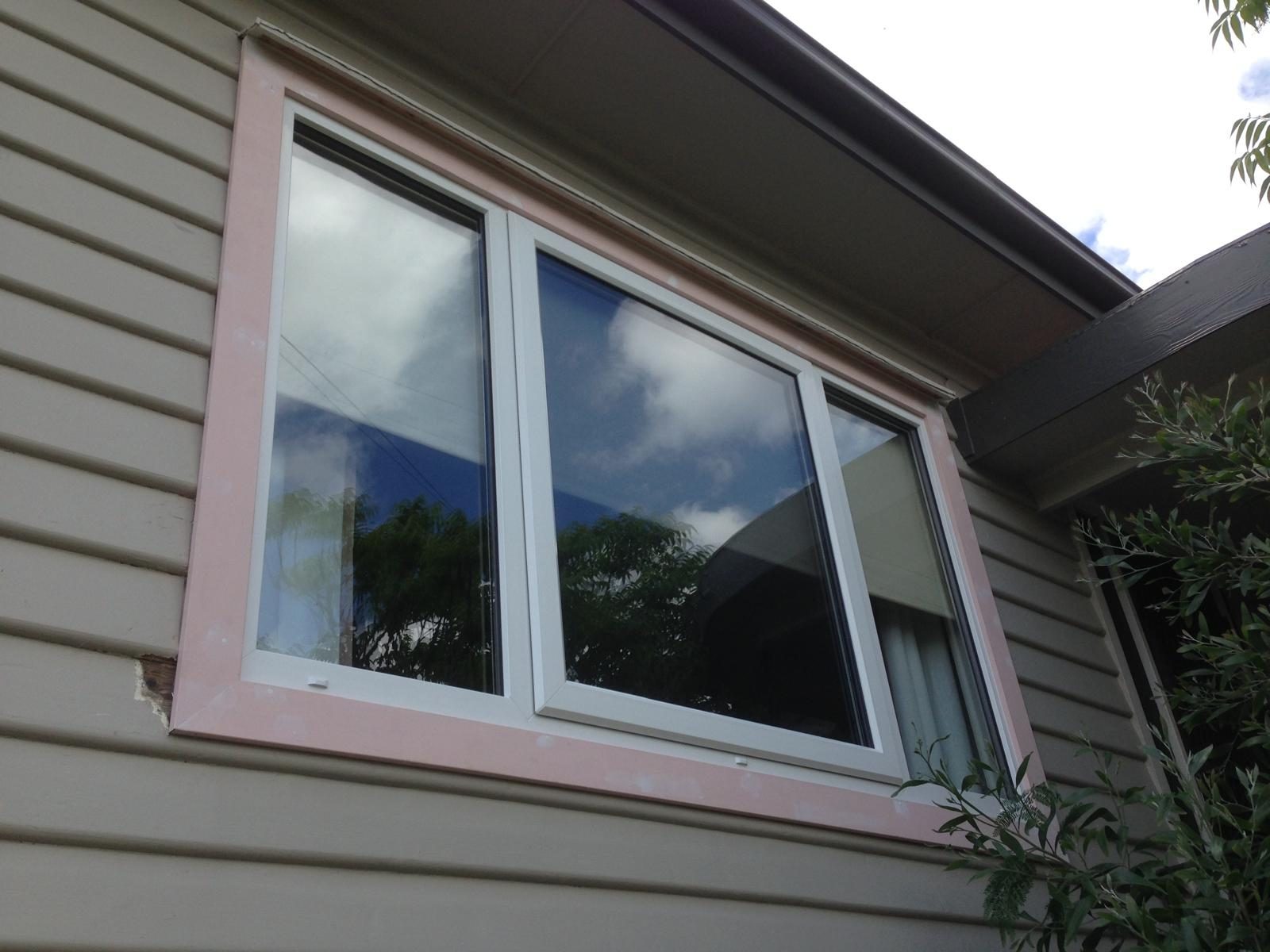 White uPVC window on a weatherboard façade