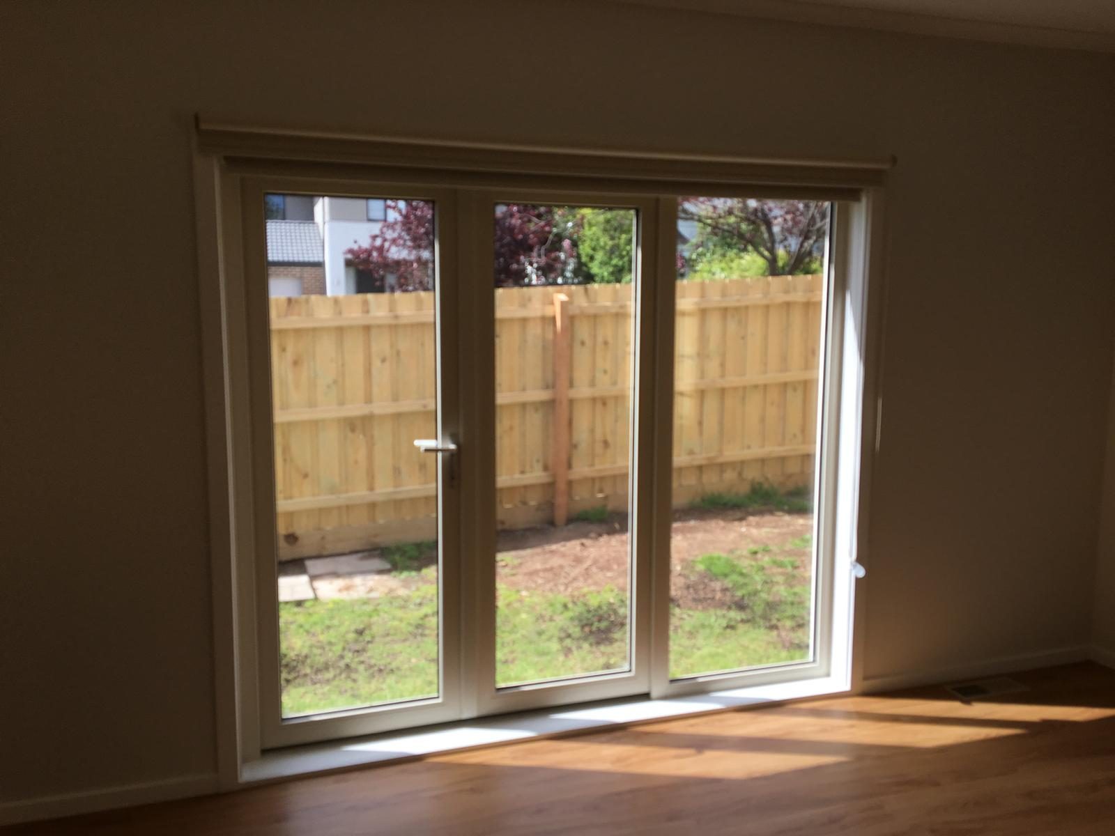 Triple panel sliding door in a living room