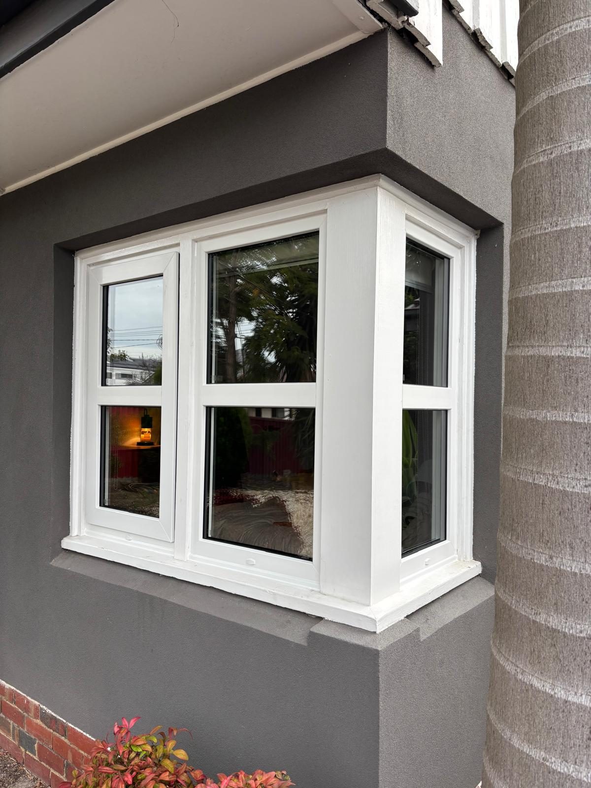 White uPVC bay window on a rendered Melbourne home
