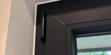 Neat internal silicone finish where a new double glazed window meets the reveal