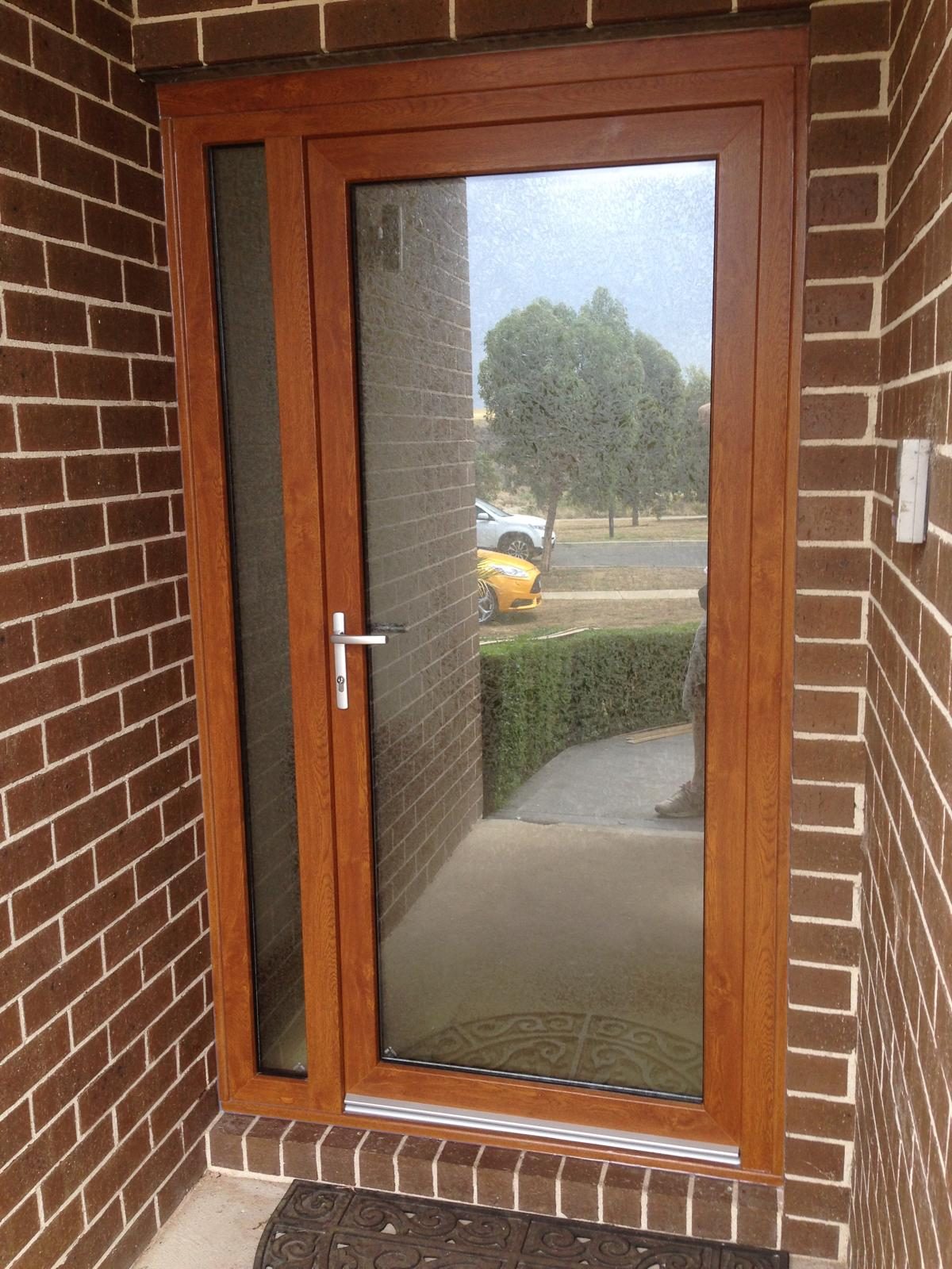Timber look uPVC door in brickwork