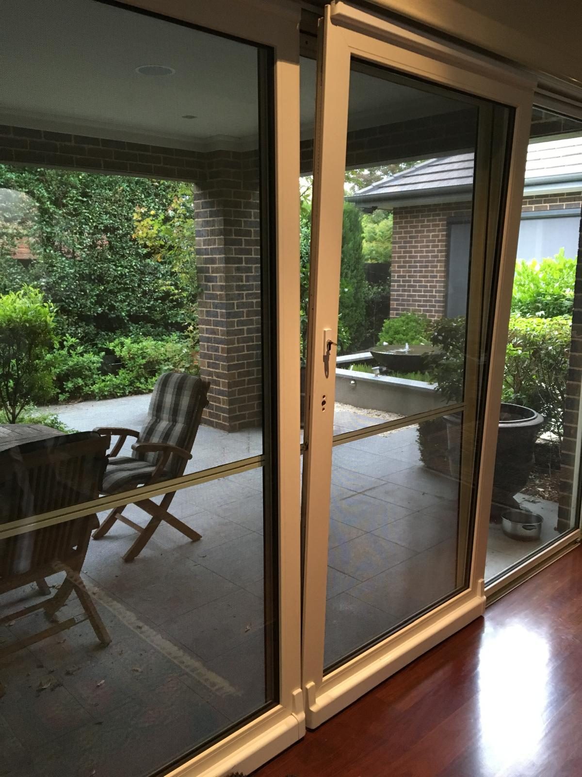 Timber look uPVC sliding door onto a verandah